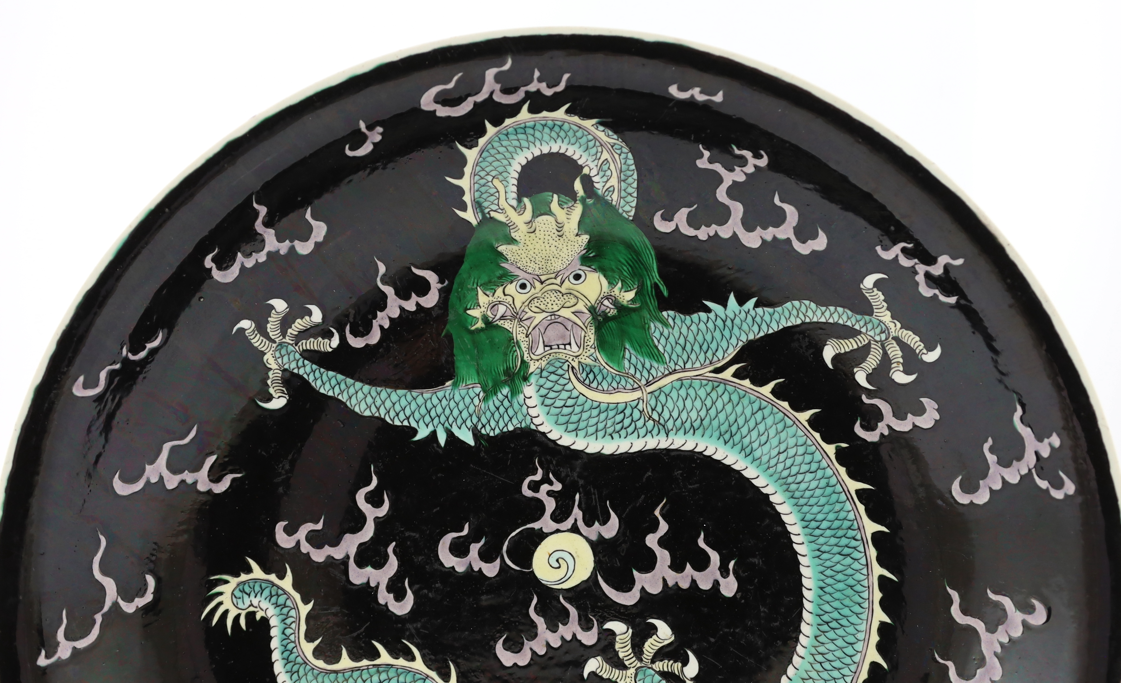 A Chinese enamelled porcelain 'dragon' dish, Kangxi mark but 19th century, small splinter rim chip, rim ground off